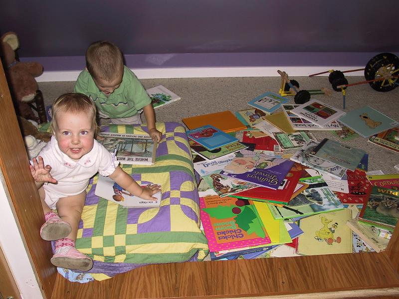 0818c.jpg - The kids play together upstairs sometimes.  I went up to check, "what are you doing?"  The answer?  "Reading books, mommy!"  Um, yeah!