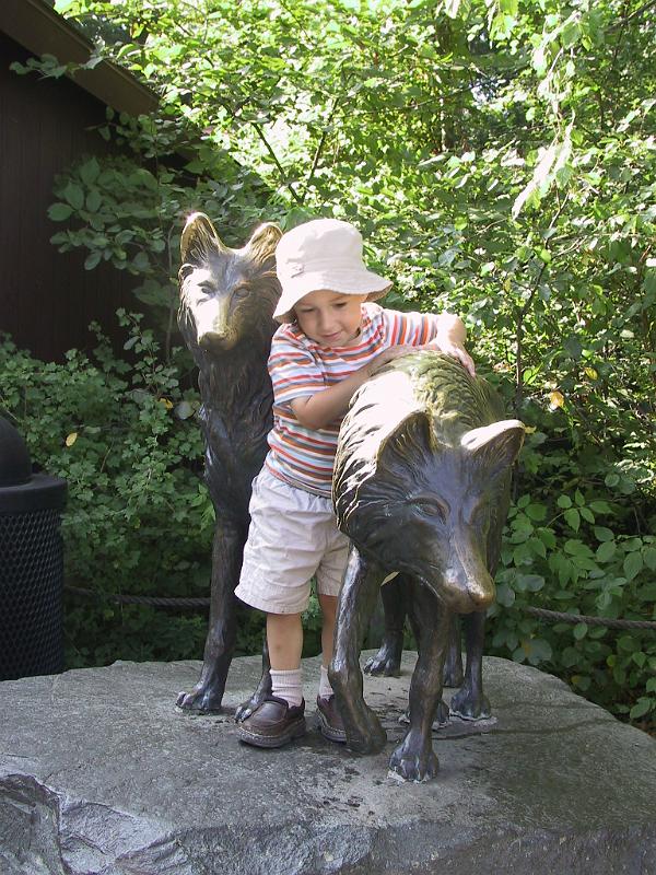 0822k-wolf.jpg - Petting the wolf statues