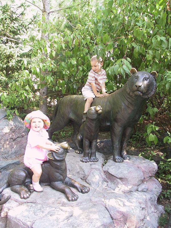 0822w-tigers.jpg - Riding the tiger statues.