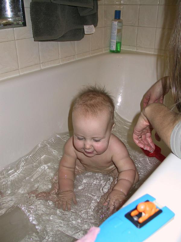 1229bath1.jpg - Showing off her arm rolls