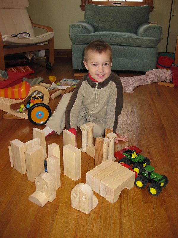 1208town-owen.jpg - Owen building a town for his vehicles to drive through.