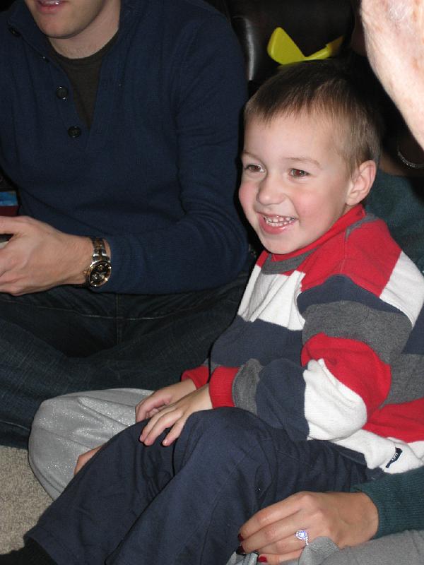 1227xmas5.jpg - Owen watching the game of Spoons.