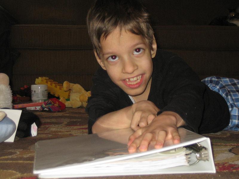 IMG_8338.JPG - Krassi likes to explore new things. Today it was the school assignment binder.
