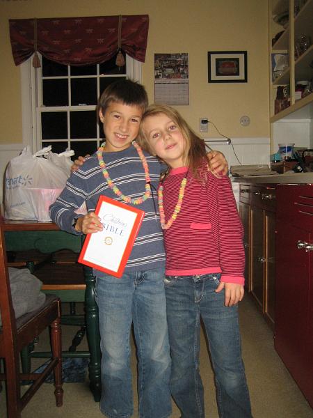 IMG_8415.JPG - Showing off Fruit Loop necklaces and Owen's 3rd grade Bible. (All the 3rd graders get a new bible from church in the fall).