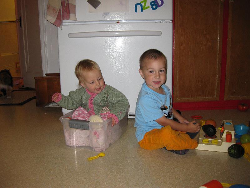 1015owen-leah.jpg - Both kids playing in the kitchen.