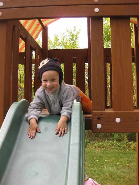 IMG_0138.JPG - Owen's new favorite way to go down the slide