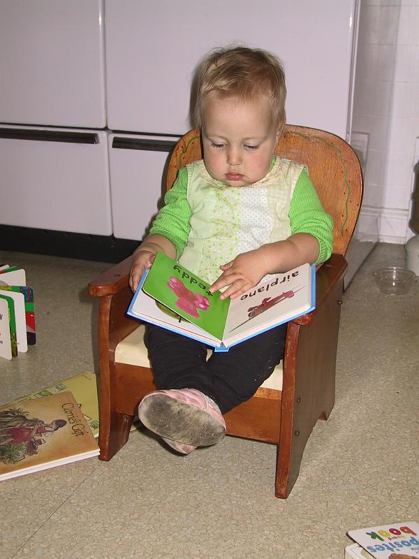 0907sit.jpg - This girl can't sit on the potty without a book.