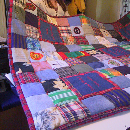 04mo-front1.jpg - Plaid flannel and denim provide a unified feel.  This quilt includes applique and embroidery.