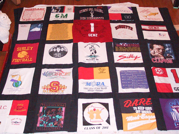 05ge-front.jpg - A highschool memory quilt with black sashing.  (Please note: the quilt is not complete in this photo.)
