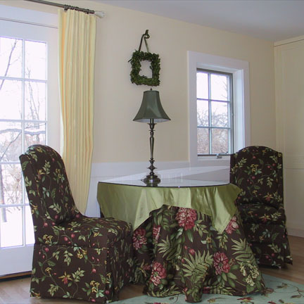 07gr-drape-table.jpg - A two-layer, custom shaped table cloth with a hole for the lamp cord.  The drape panels on ring clips were done by me as well (though not fully trained yet in this photo, which is why they are not yet hanging properly.)